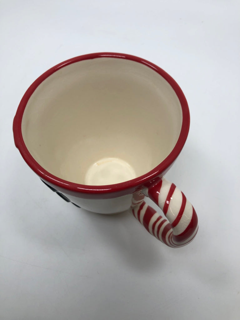 WHITE MUG RED SCARF BLACK BUTTONS.