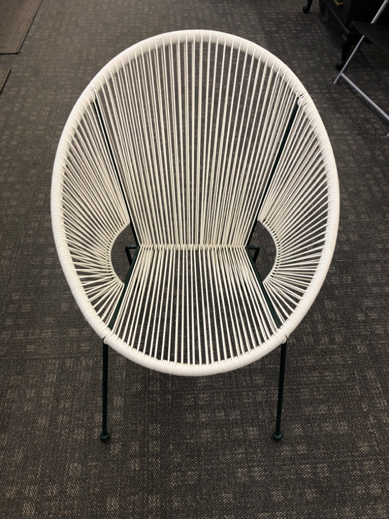 WOVEN PLASTIC EGG-SHAPED CHAIR W/GREEN LEGS.