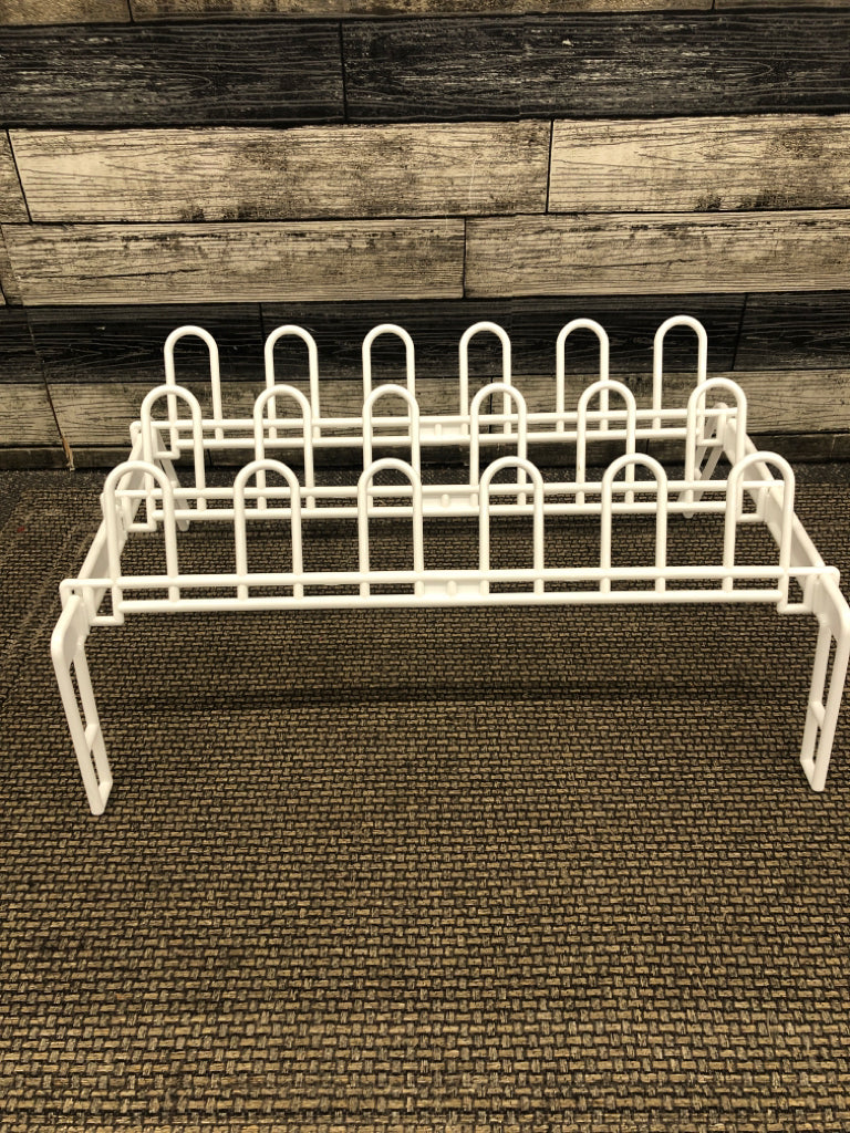 WHITE PLASTIC STANDING SHOE RACK.