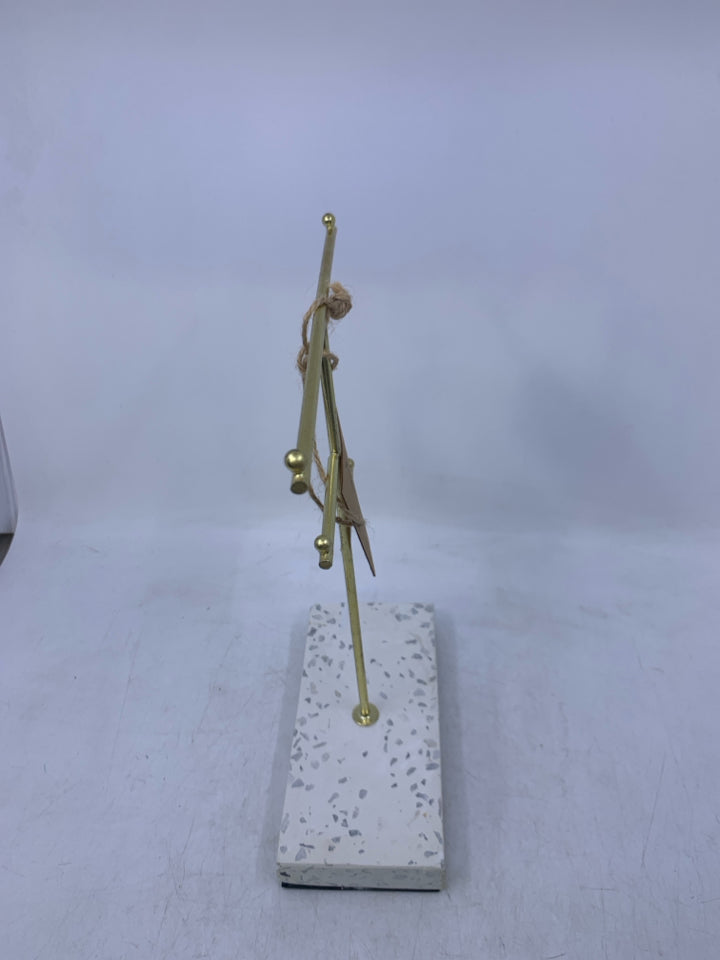 WHITE BASE W/ GOLD METAL JEWELRY STAND.