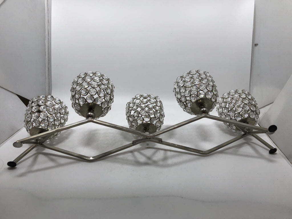 SILVER METAL AND CLEAR BEADED VOTIVE CANDLE HOLDER.