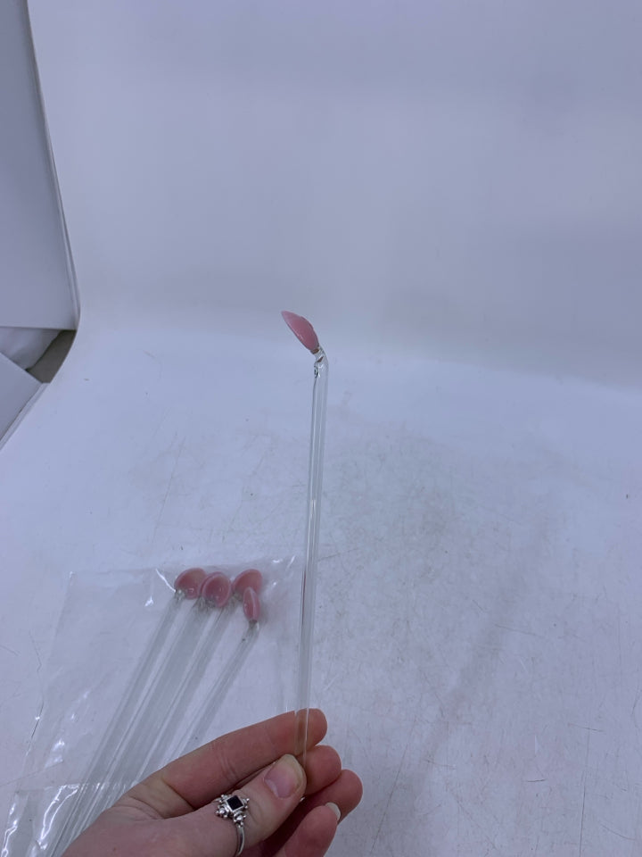 6 GLASS DRINK STRRING SPOONS W/ PINK BASES IN BAG.