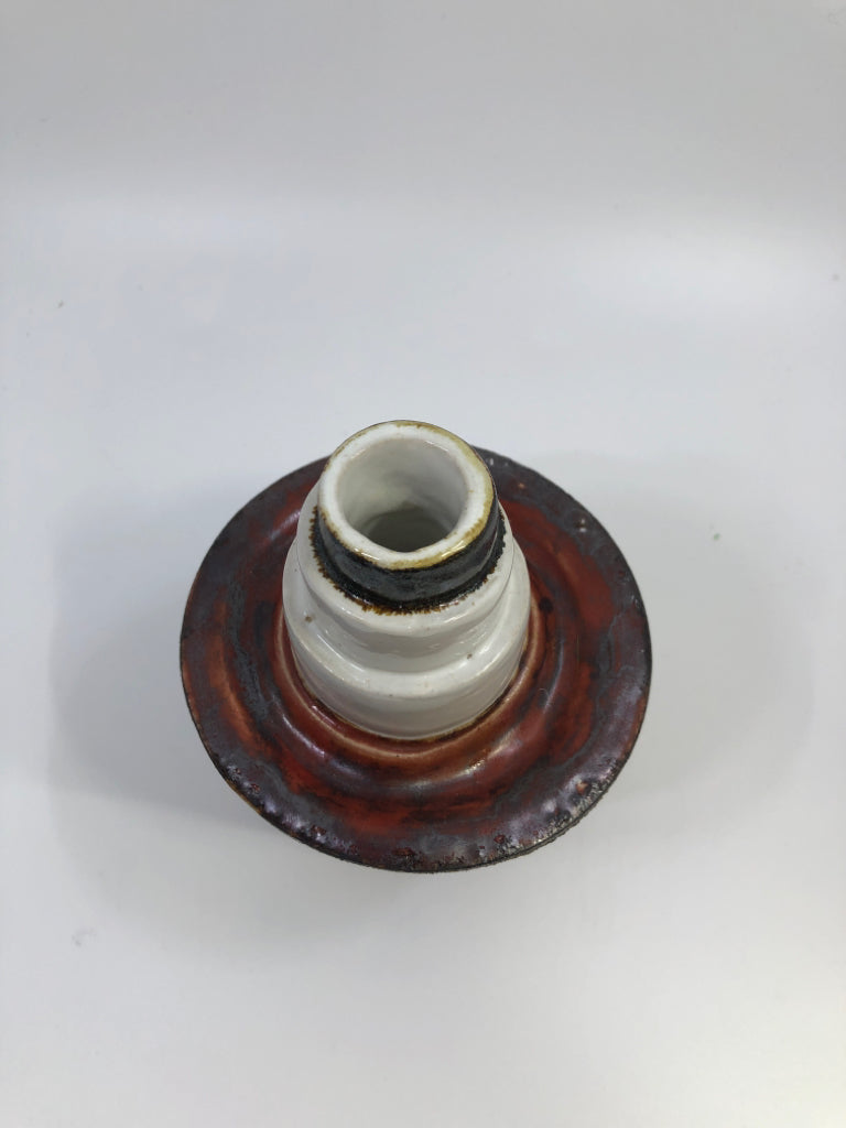 ROUGHED CERAMIC VASE W/RED & WHITE LAYERS.