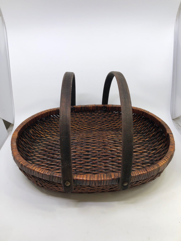 DARK BROWN OVAL BASKET W/ 2 HANDLES.
