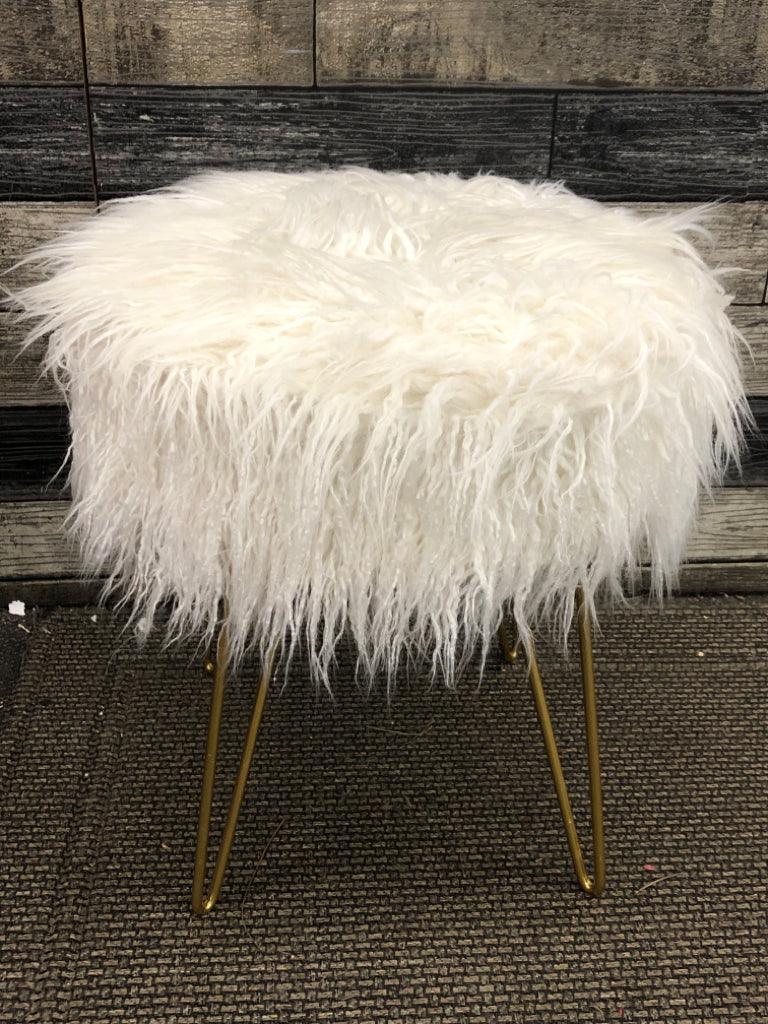 FUZZY STOOL W/GOLD METAL LEGS.