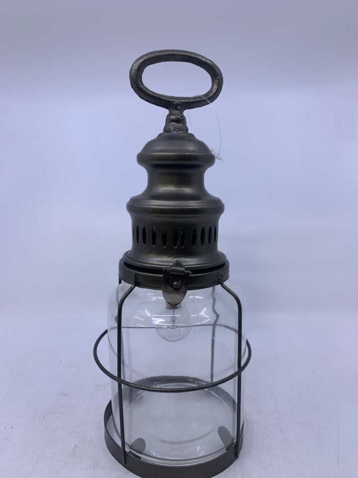 GREY METAL W/ GLASS BATTERY POWERED LANTERN.