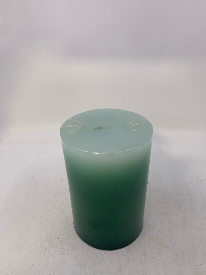 LARGE GREEN/TEAL PILLAR CANDLE.