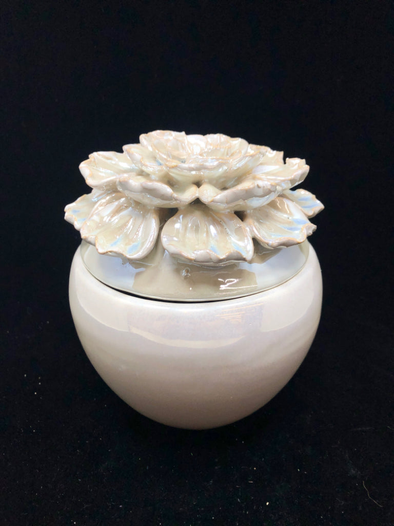 IRIDESCENT CERAMIC JAR W/FLOWER LID.
