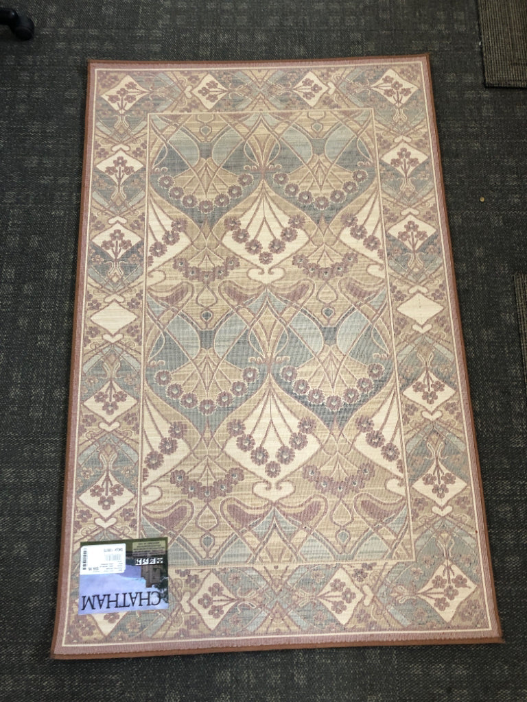 BROWN CHATHAM FLORAL RUG.