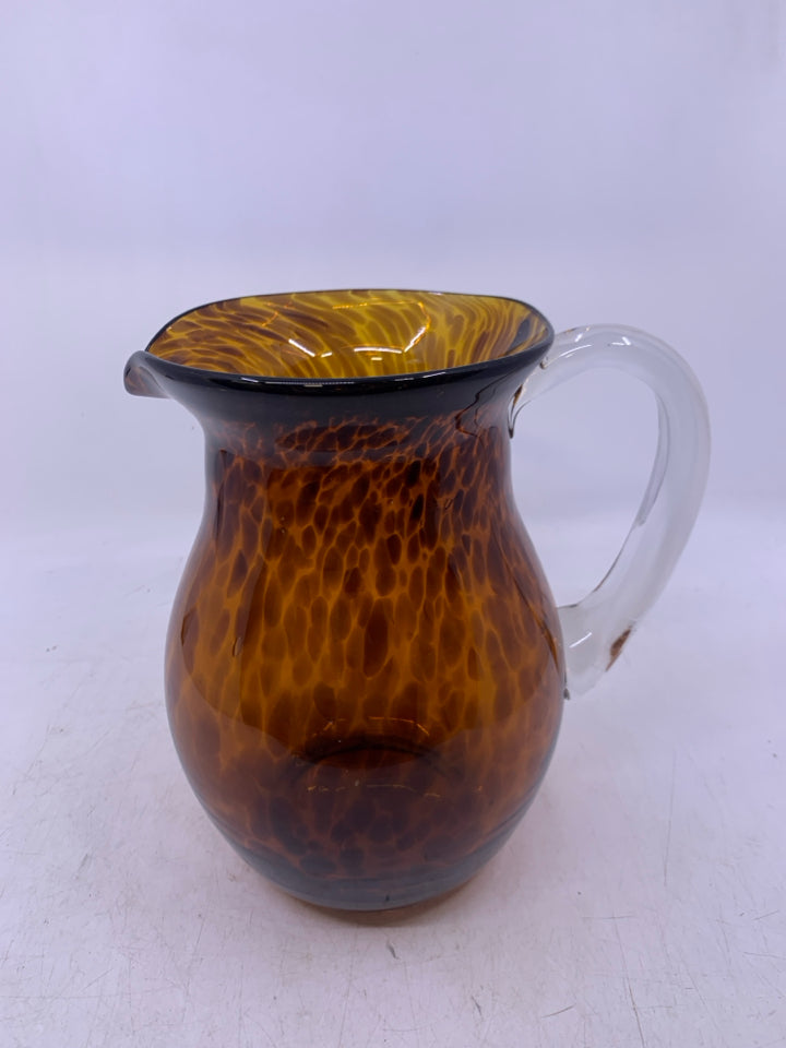 BLOWN GLASS LIGHT BROWN W/ SPECKLES CLEAR HANDLE.