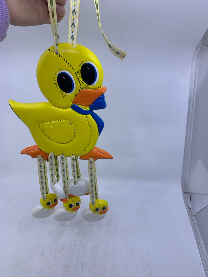 CERAMIC YELLOW DUCK W/ HANGING HATCHING DUCKLINGS.