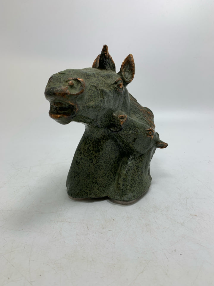 GREEN METAL HEAVY HORSE HEAD W/ BABY FIGURINE.