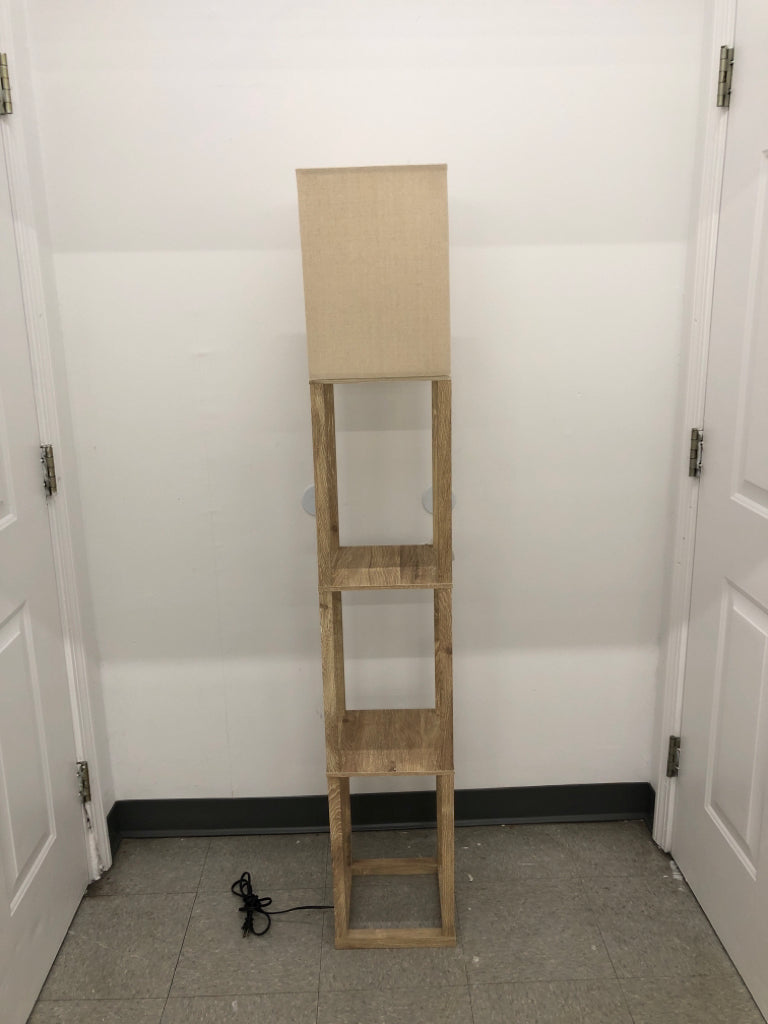 BLONDE WOOD SHELF FLOOR LAMP W/ CREAM SHADE.