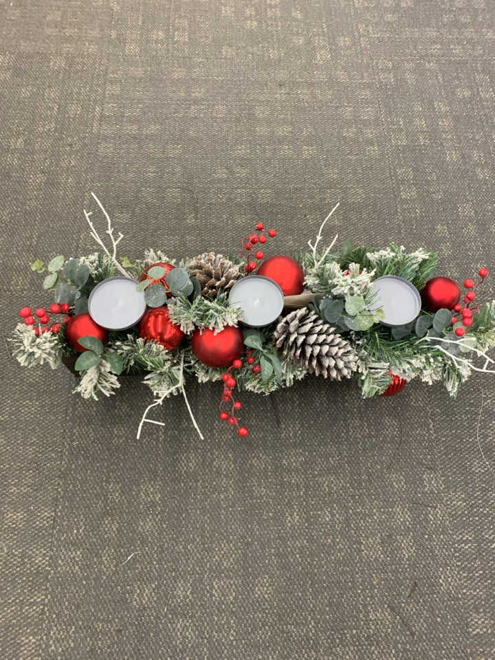 WOODEN BOX CANDLE HOLDER W/ WINTER FOLIAGE AND RED ORNAMENTS.