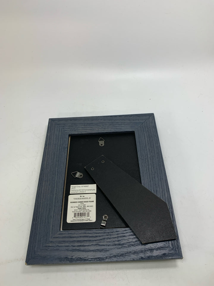 NAVY BLUE FRAME W/ FISH PICTURE.