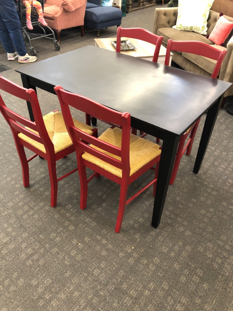 BLACK CONTEMPORARY TABLE & 4 RED CHAIRS W/WICKER SEAT.