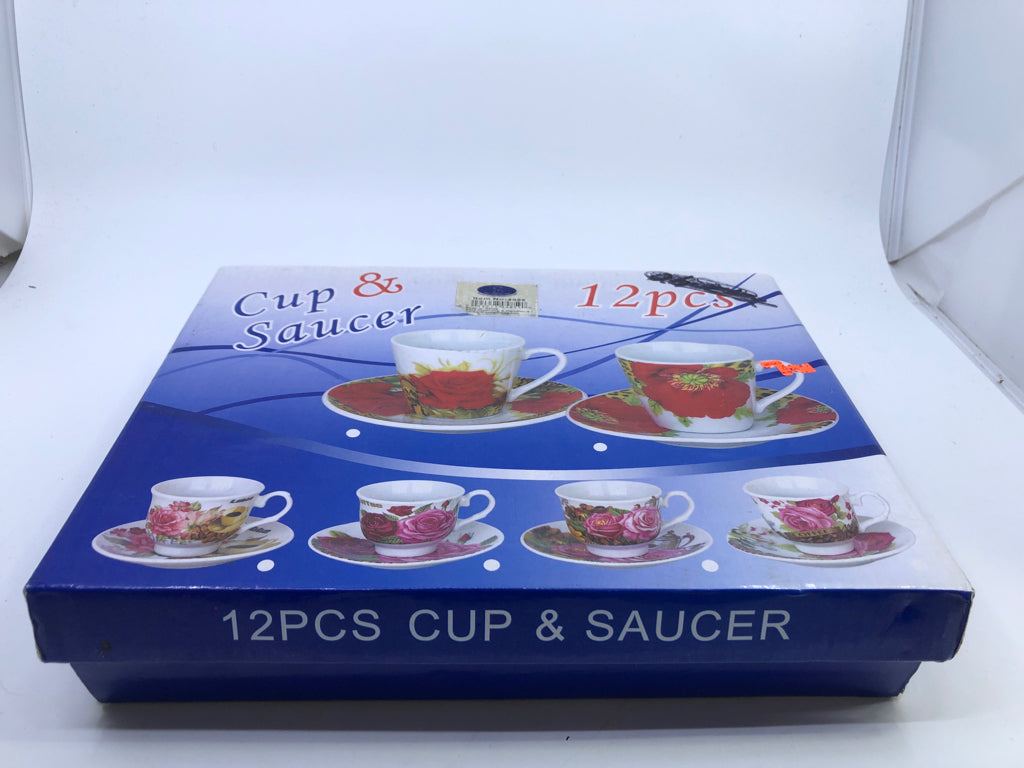 NIB 6 FLORAL CUP AND SAUCER SET.