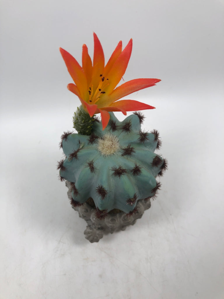 FAUX BLUE CACTUS IN CERAMIC CACTUS POT.
