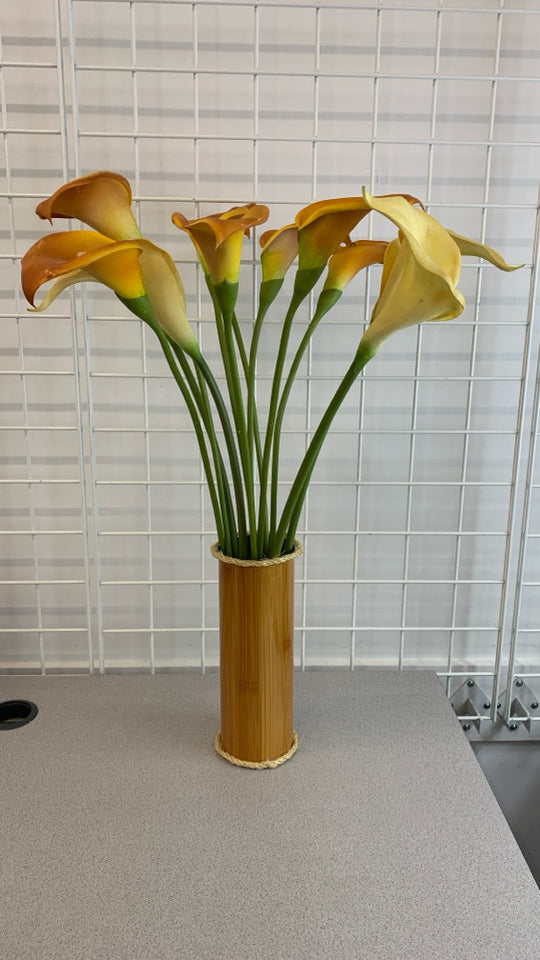 FAUX LILIES IN METAL FAUX WOOD VASE.