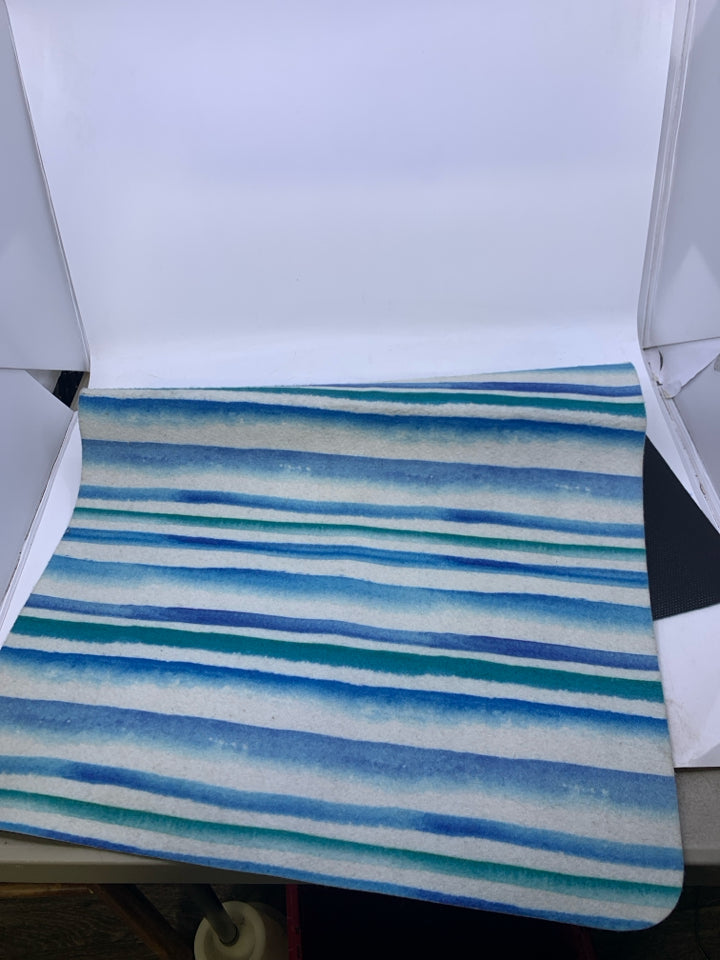BLUE/GREEN STRIPPED SKID RESISTANT ACCENT RUG.
