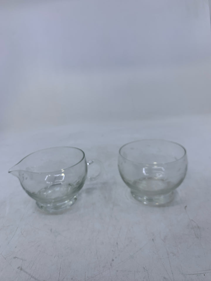 CLEAR GLASS W/ ETCHED FLOWERS.