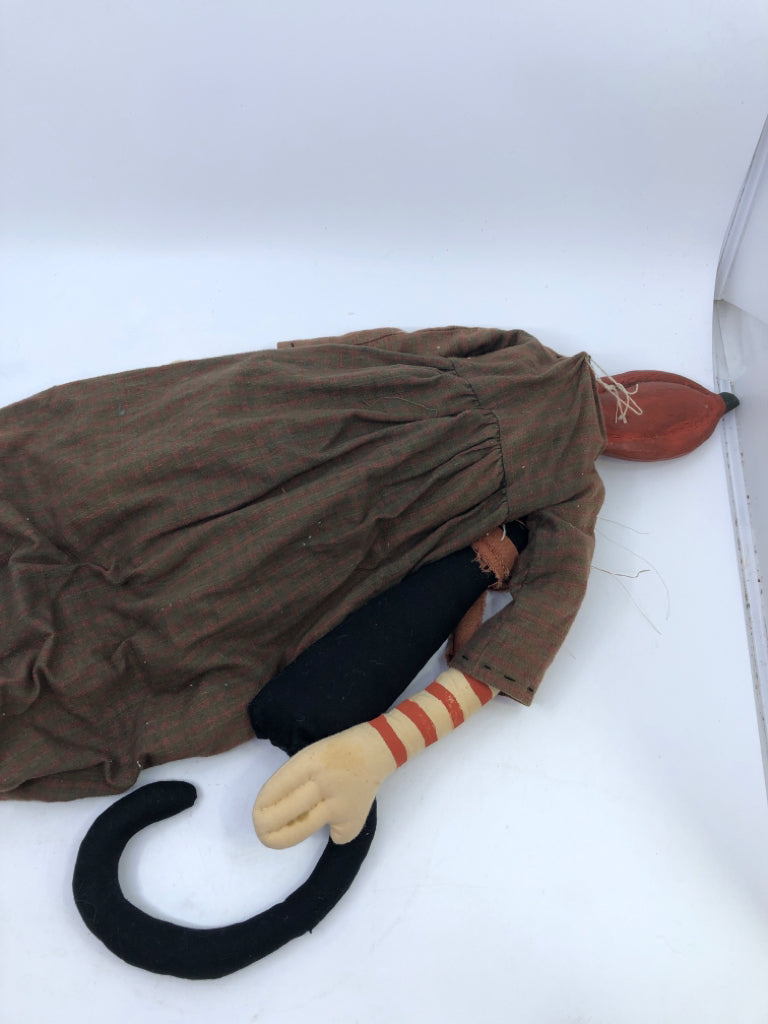 PRIMITIVE PUMPKIN MAN HOLDING BLACK CAT.