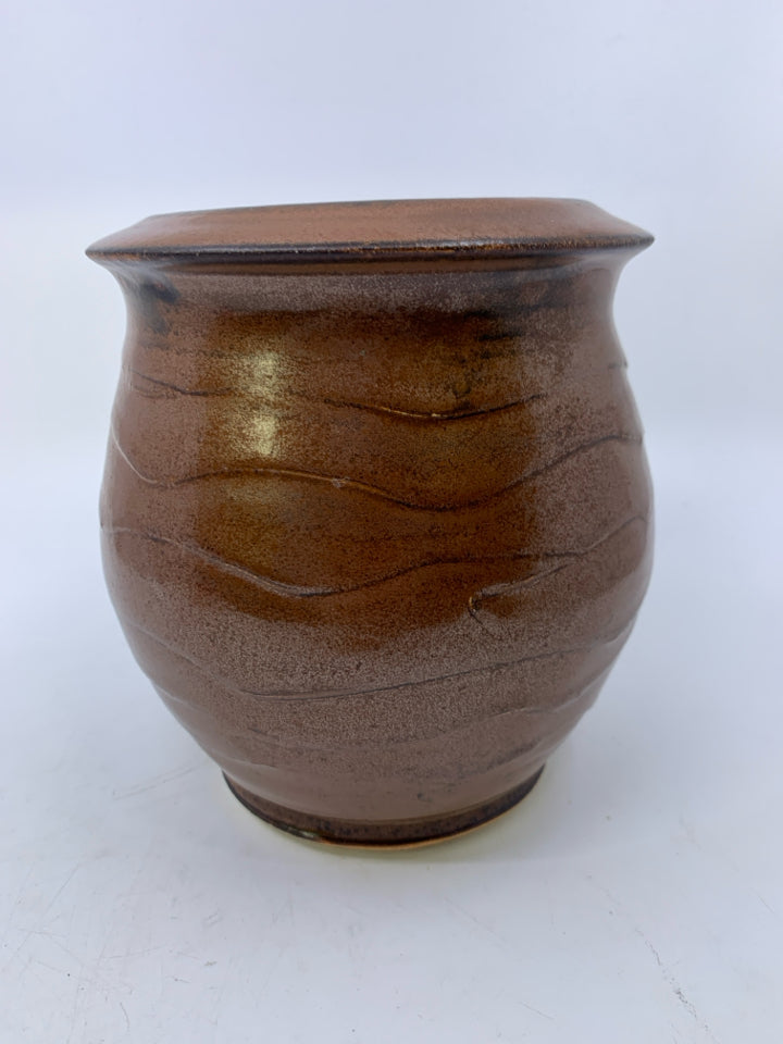 HEAVY RUST COLORED W/ WAVY CARVED LINES VASE.