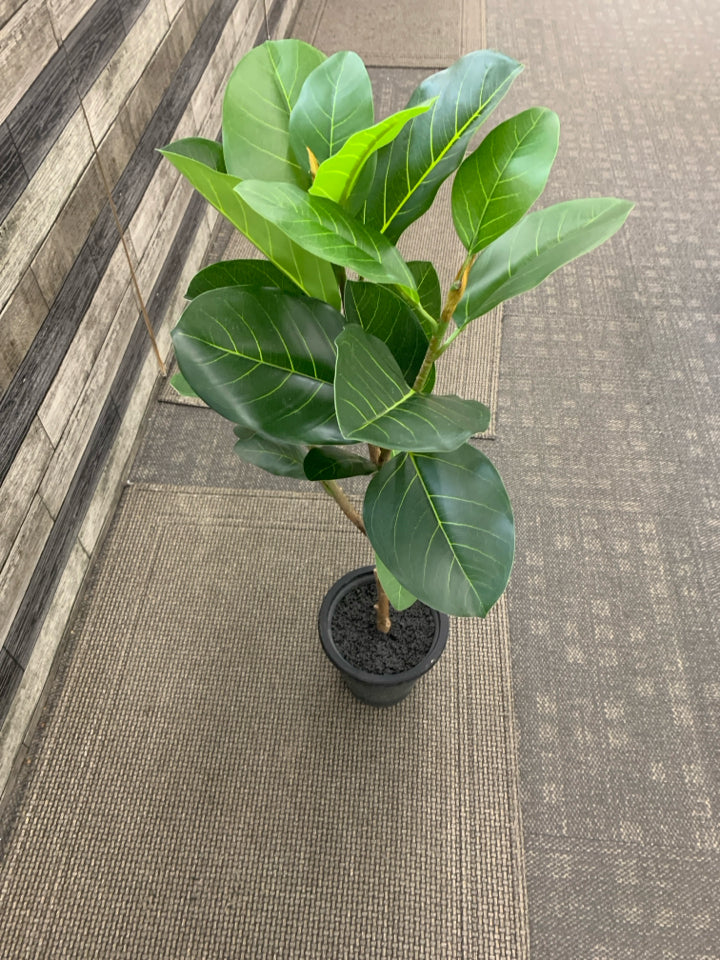 TALL FAUX PLANT IN BLACK PLANTER.