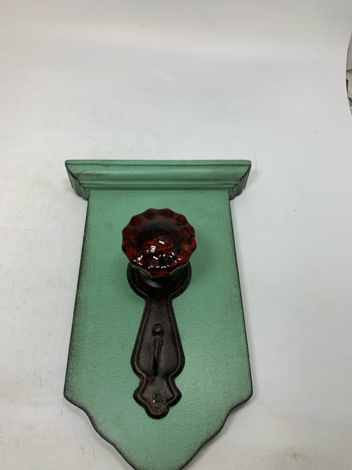 RUSTING DOOR KNOB HOOK WALL HANGING.