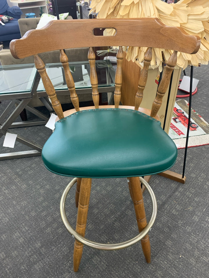 2 WOOD BAR STOOL W/GREEN UPHOLSTERED CUSHION & METAL FOOT REST.