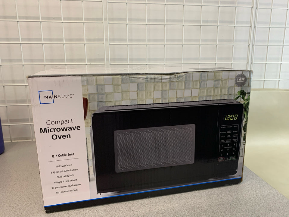 NIB MICROWAVE OVEN.