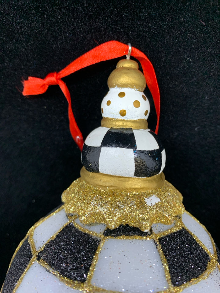 SPARKLY CHECKERED BALL ORNAMENT W/ DOT BULB ON TOP.