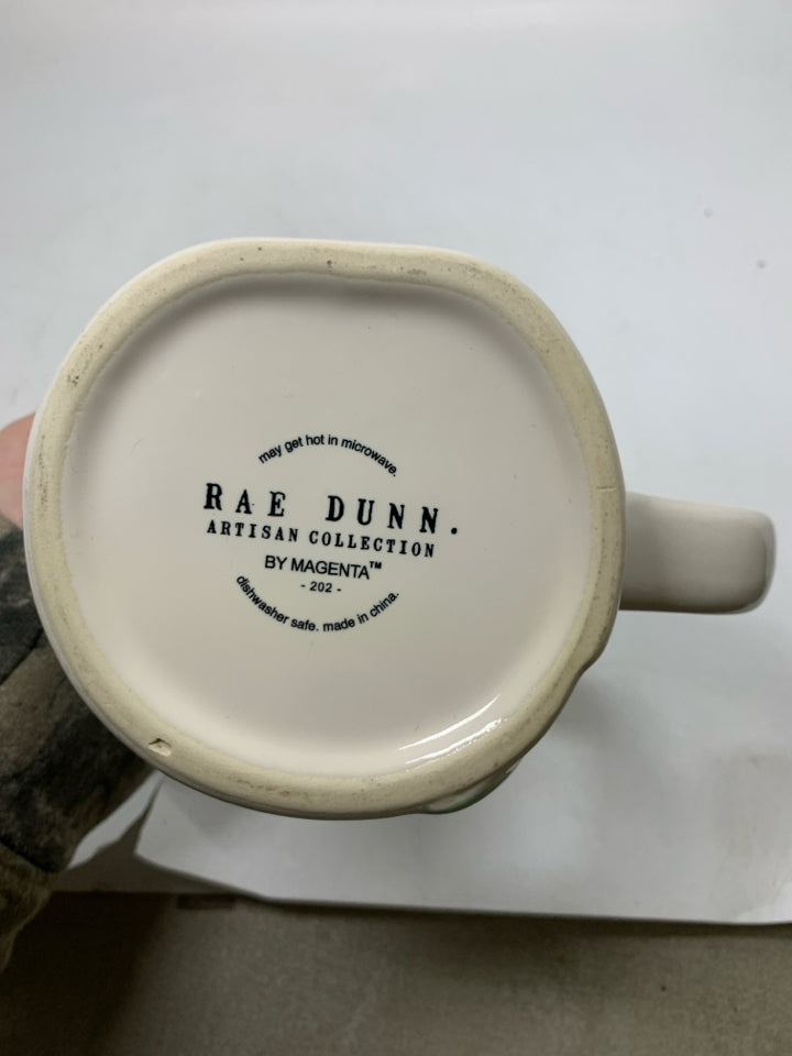 LOVE GROWS HERE MUG.