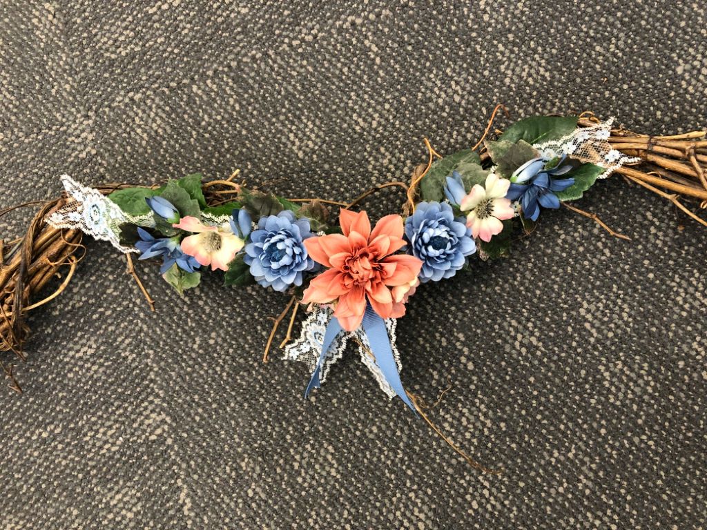 FAUX FLORAL AND TWIG SWAG.