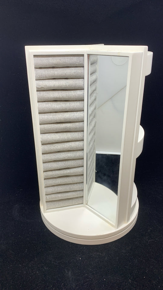ROTATING GRAY FABRIC JEWELRY HOLDER.