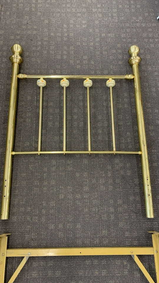 BRASS TWIN BED FRAME W/CERAMIC FLORAL BALL DETAILS.