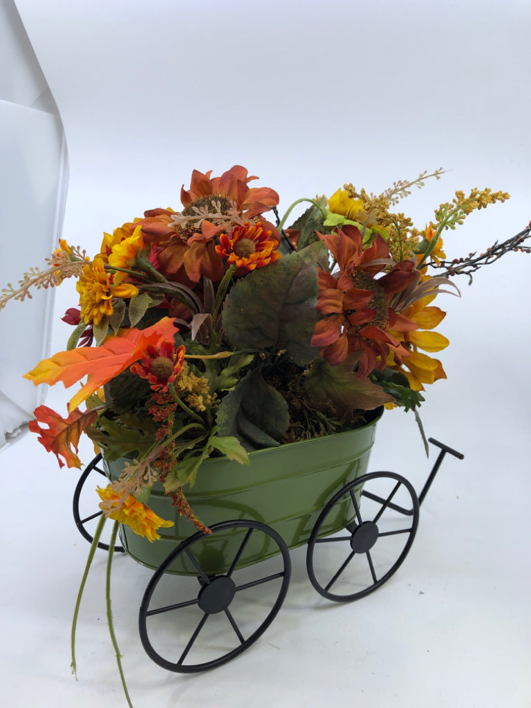 FAUX FALL BOUQUET IN GREEN METAL WAGON.