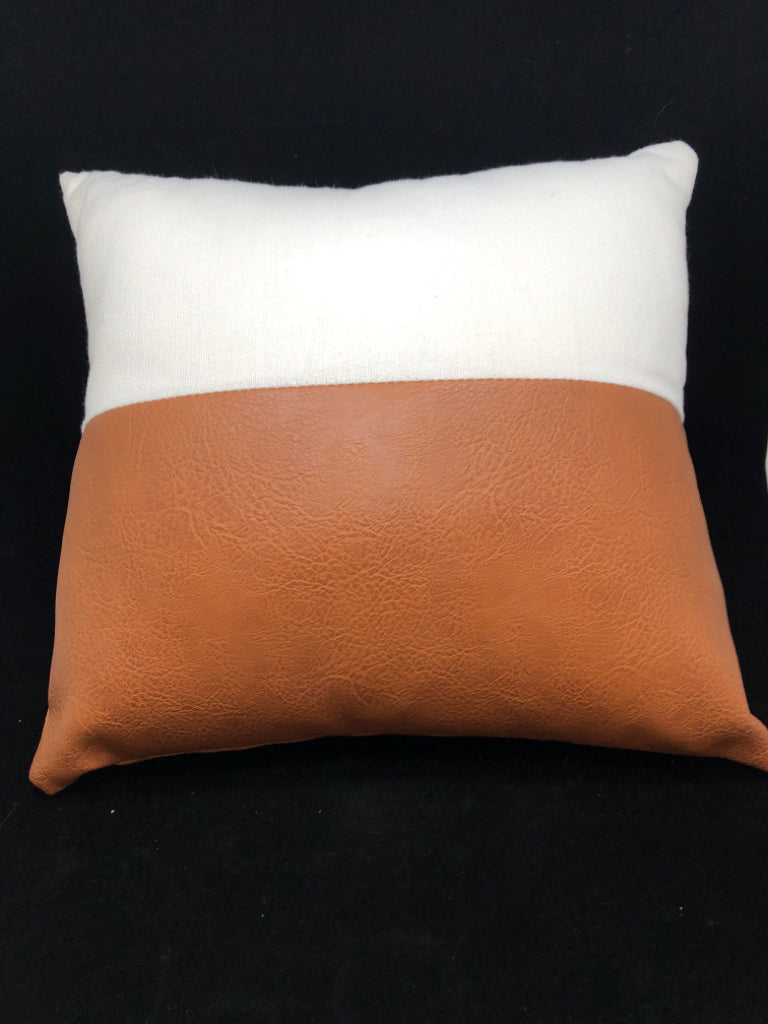 WHITE/BROWN LEATHER PILLOW.
