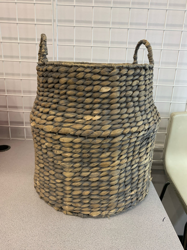 GRAY AND BEIGE WICKER BASKET.