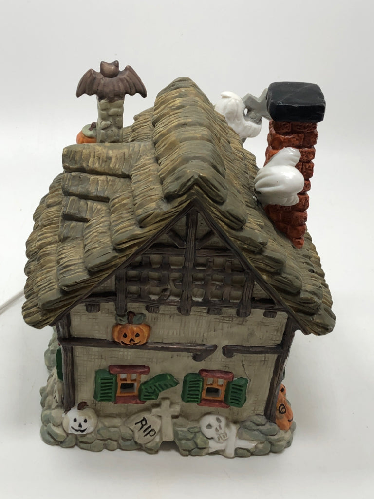 PORCELAIN ILLUMINATED HAUNTED HOUSE W/GHOSTS.
