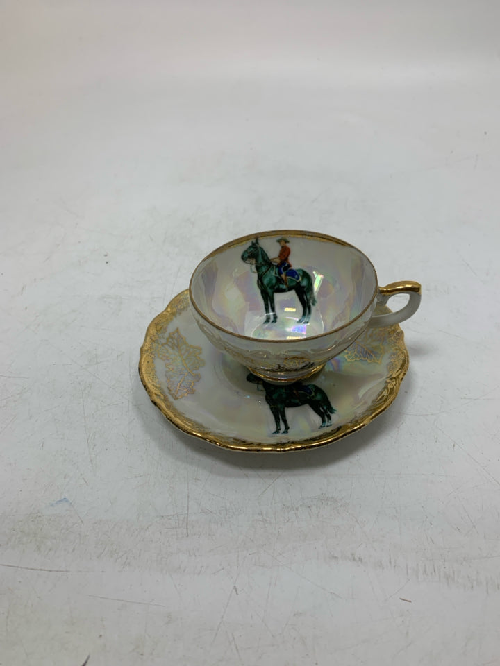 IRIDESCENT SMALL TEACUP W/ MAN RIDING HORSE.