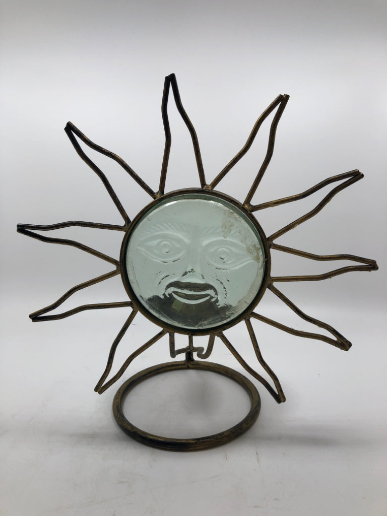 GOLD METAL AND GLASS SUN FACE CANDLE HOLDER.