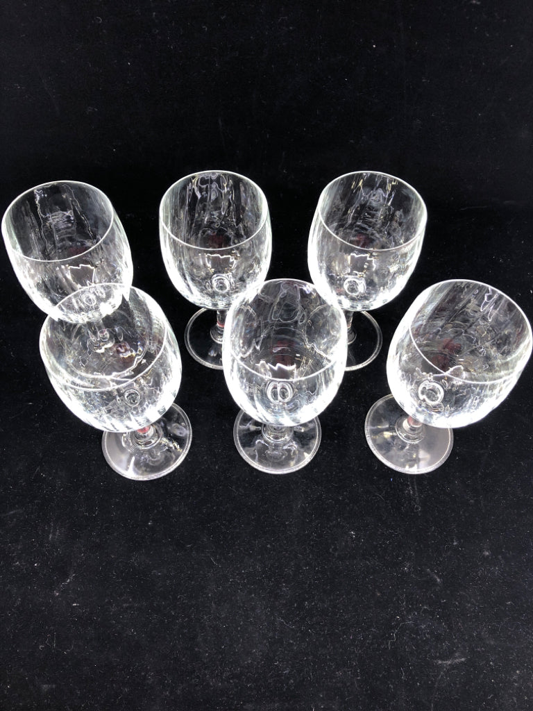 6 SLIGHT RIB WINE GLASSES.
