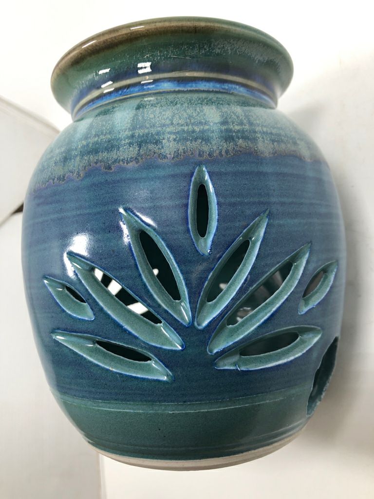 GRASS CUT-OUT BLUE GLAZED CANDLE HOLDER.