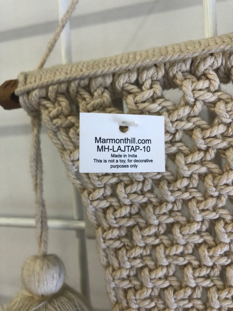 MACRAME WALL HANGING ON DOWEL W/ LARGE TASSELS.