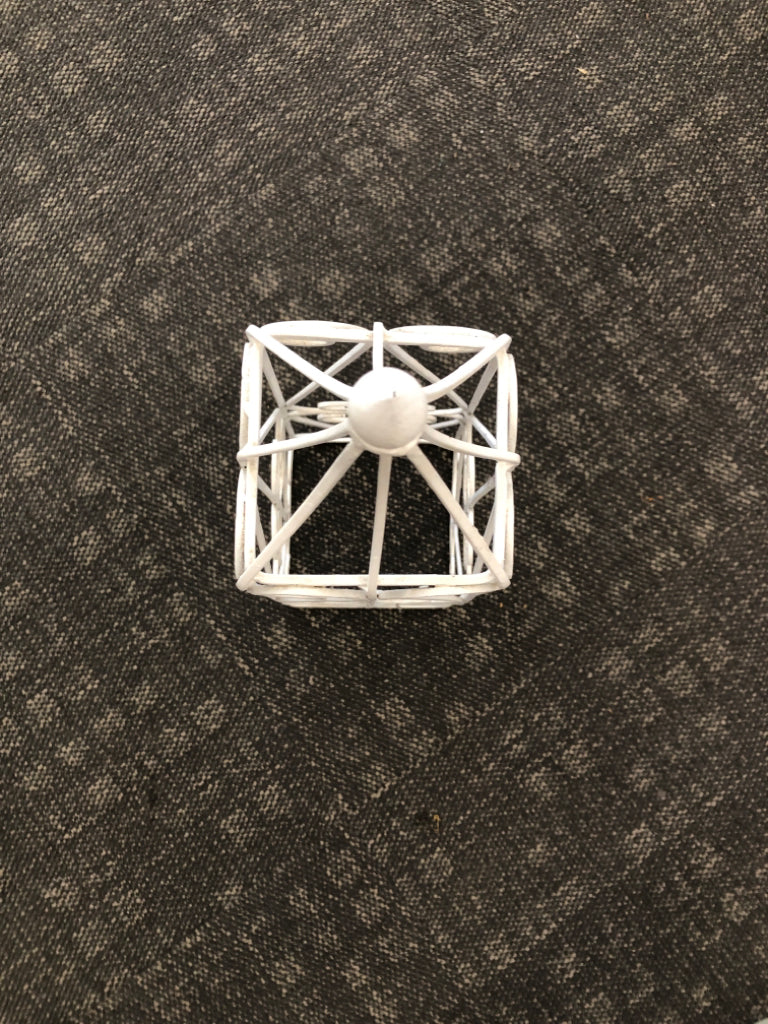 WHITE METAL SCROLL PRISM.