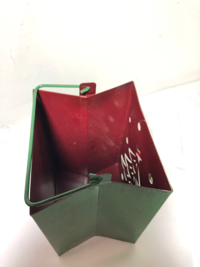 GREEN METAL PIERCED BAG CANDLE HOLDER W HANDLES.