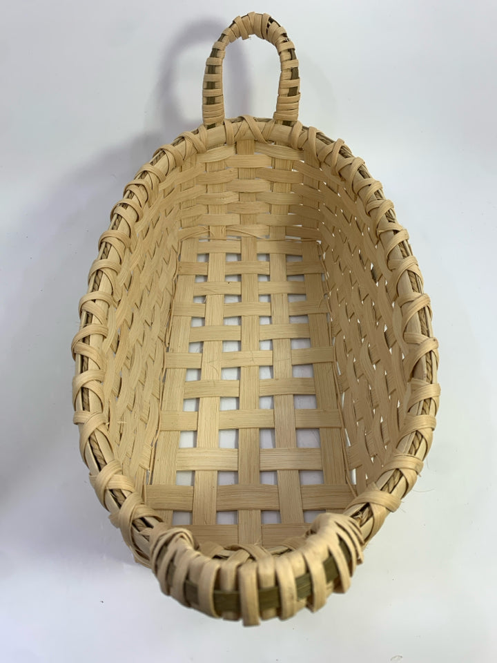 BLONDE OVAL WOVEN BASKET W HANDLES W/GRAY STRIPE.