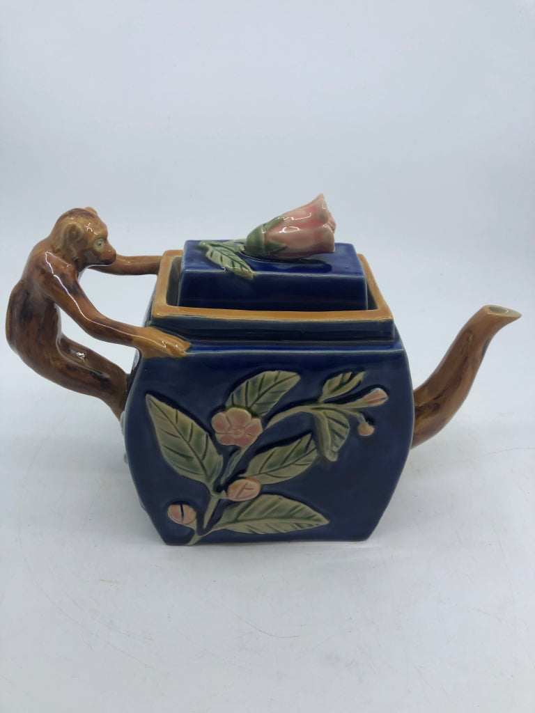 MAJOLICA STYLE TEAPOT W/ EMBOSSED PINK FLOWERS MONKEY AS HANDLE NUMBERED.