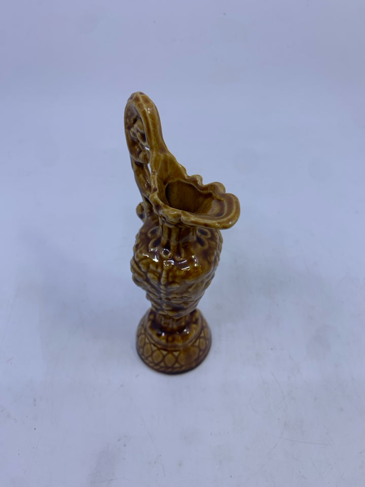VTG BROWN EMBOSSED CERAMIC PITCHER.